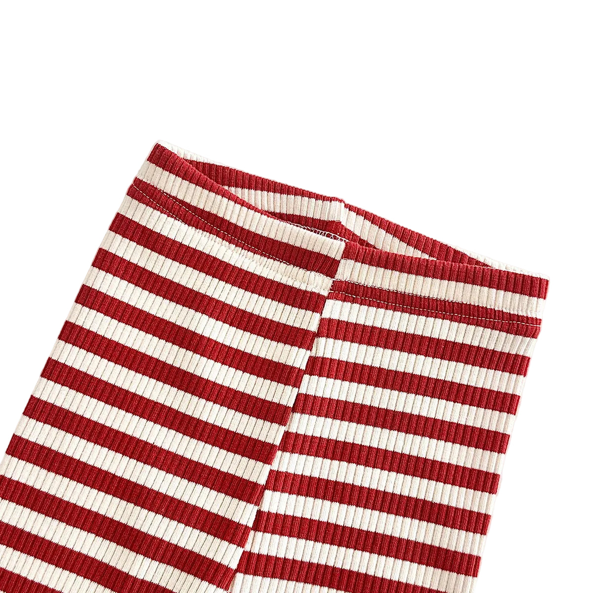 Detailed view of the elastic waistband and the vertical knit texture on the red and white striped ribbed toddler leggings.