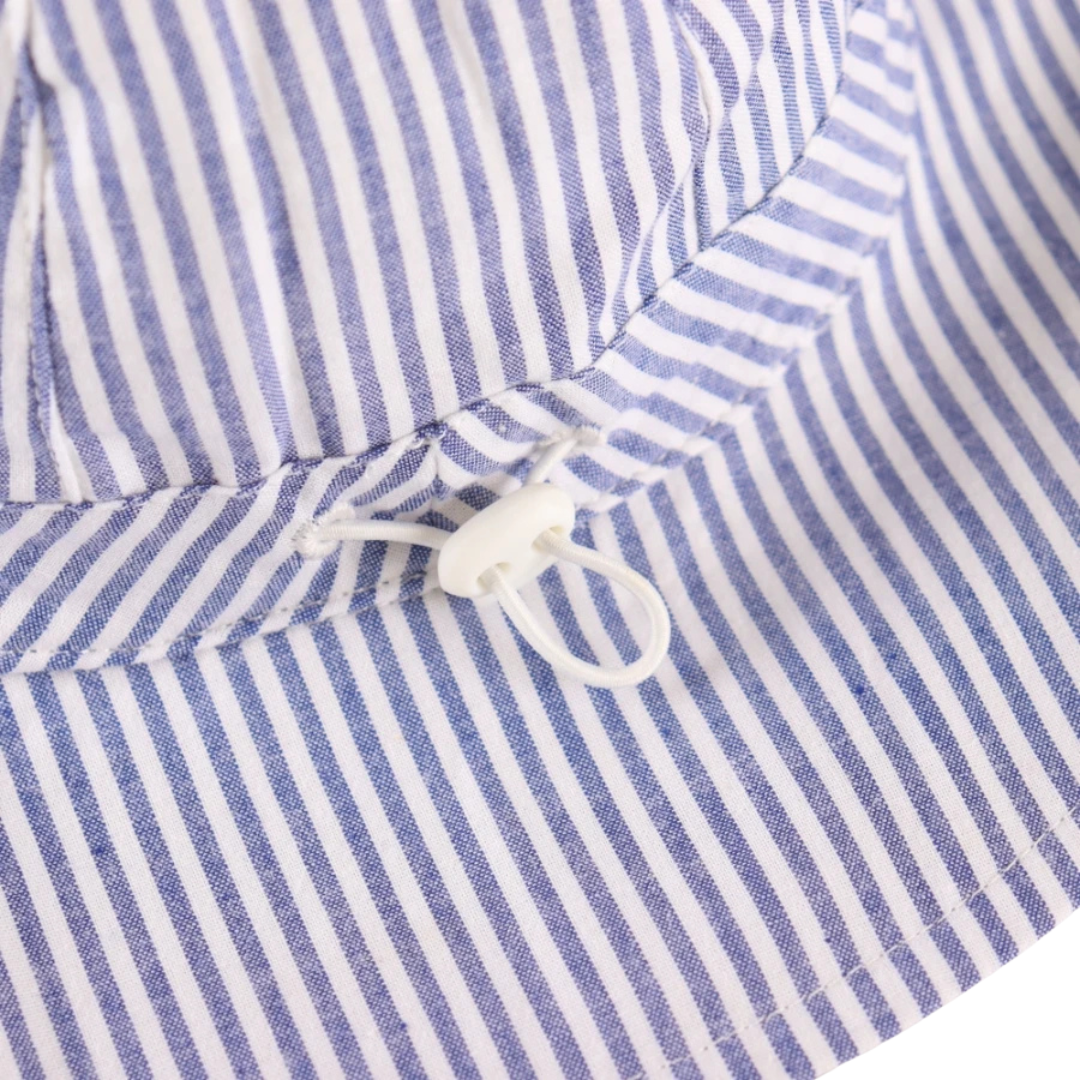Close-up detail of the adjustable head drawstring and toggle on the back of the kidsely striped baby sun hat.