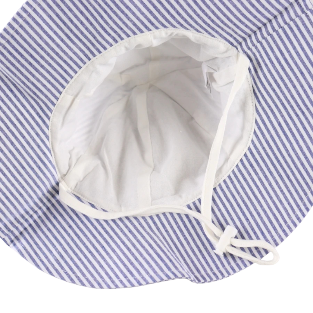 Inside view of the kidsely baby sun hat showing the soft, breathable white cotton lining and attached chin strap.