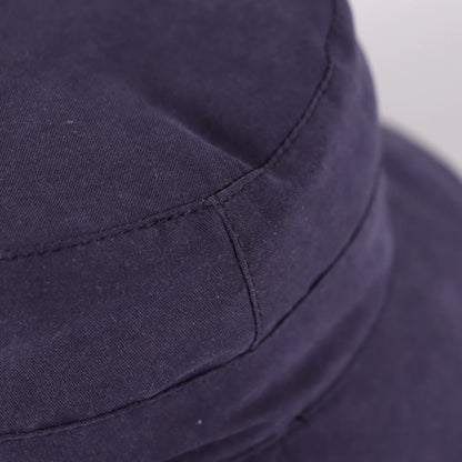 Close up of the UV protection exterior fabric and stitching on the dark blue toddler bucket hat.