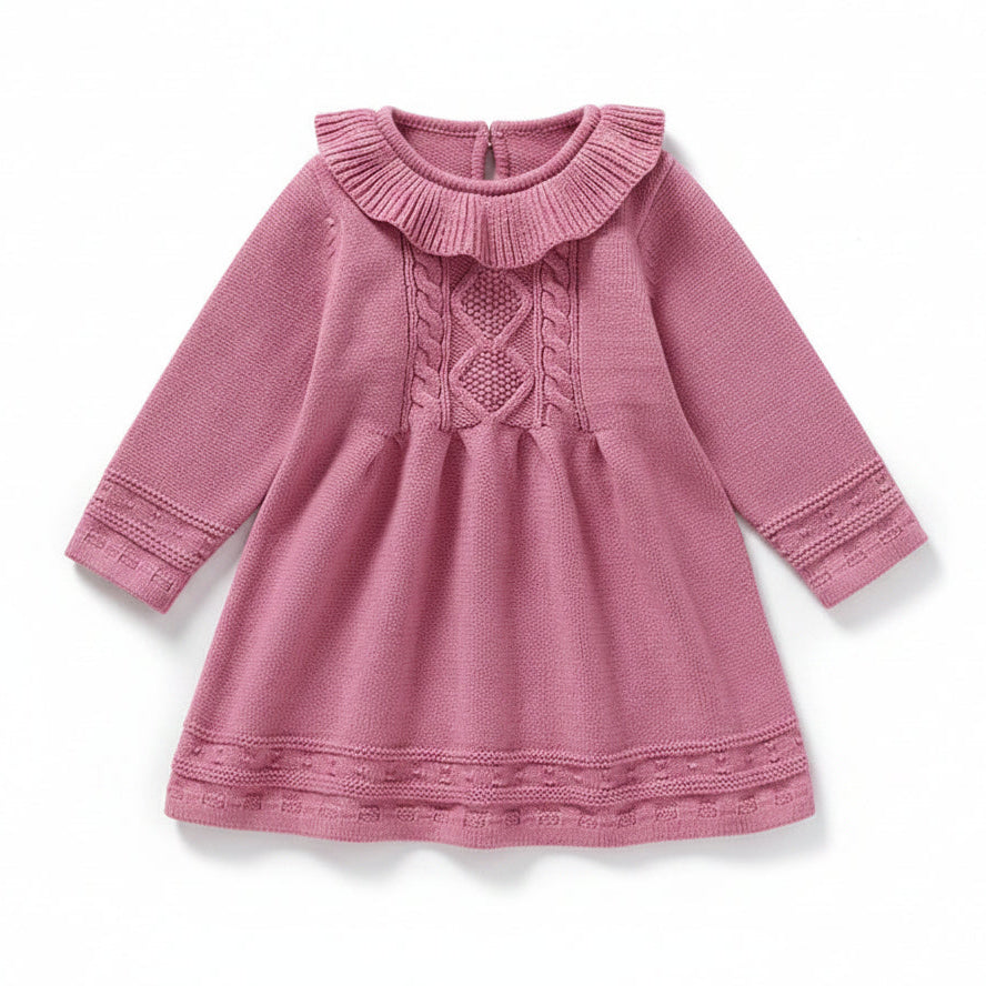Front view of a pink long sleeve cable knit sweater dress for baby and toddler girls featuring a ruffle collar.