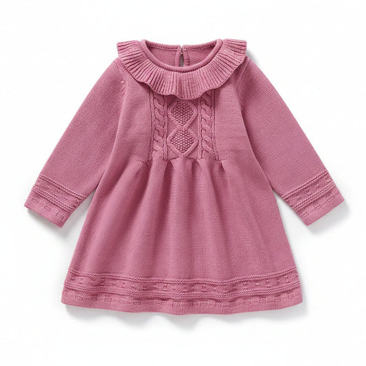 Front view of a pink long sleeve cable knit sweater dress for baby and toddler girls featuring a ruffle collar.