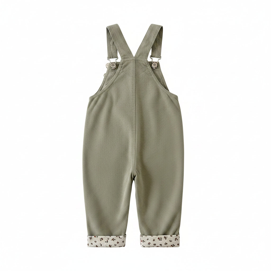 Back view of baby and toddler girls sage green corduroy overalls featuring adjustable suspender straps.