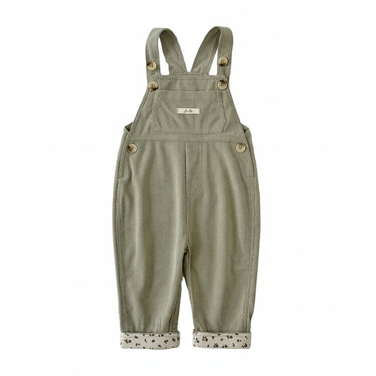 Baby and toddler girls sage green corduroy overalls with rolled floral cuffs shown from the front on a plain white background.