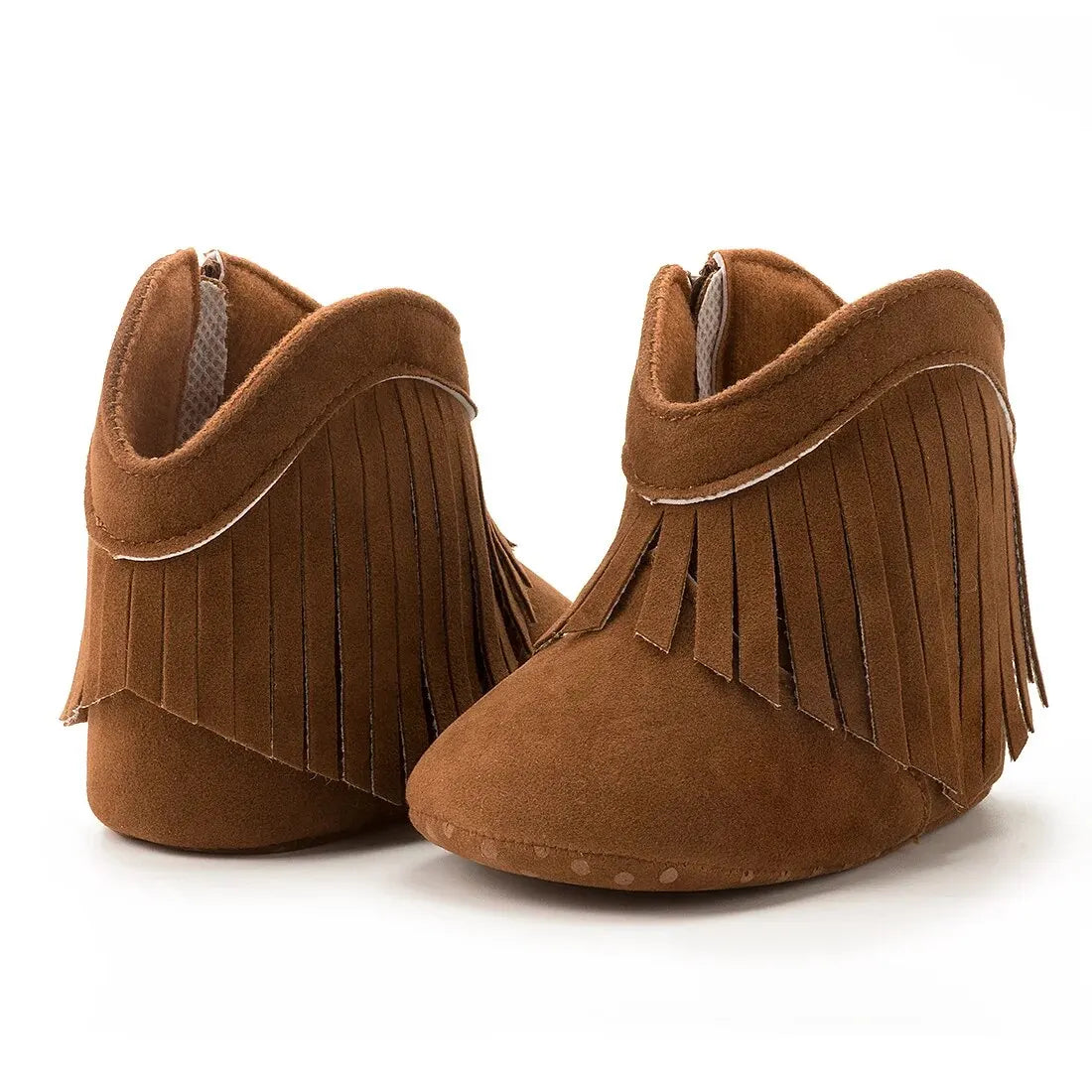 Brown baby western fringe moccasin booties displaying the anti-slip dotted soft sole on a white background.