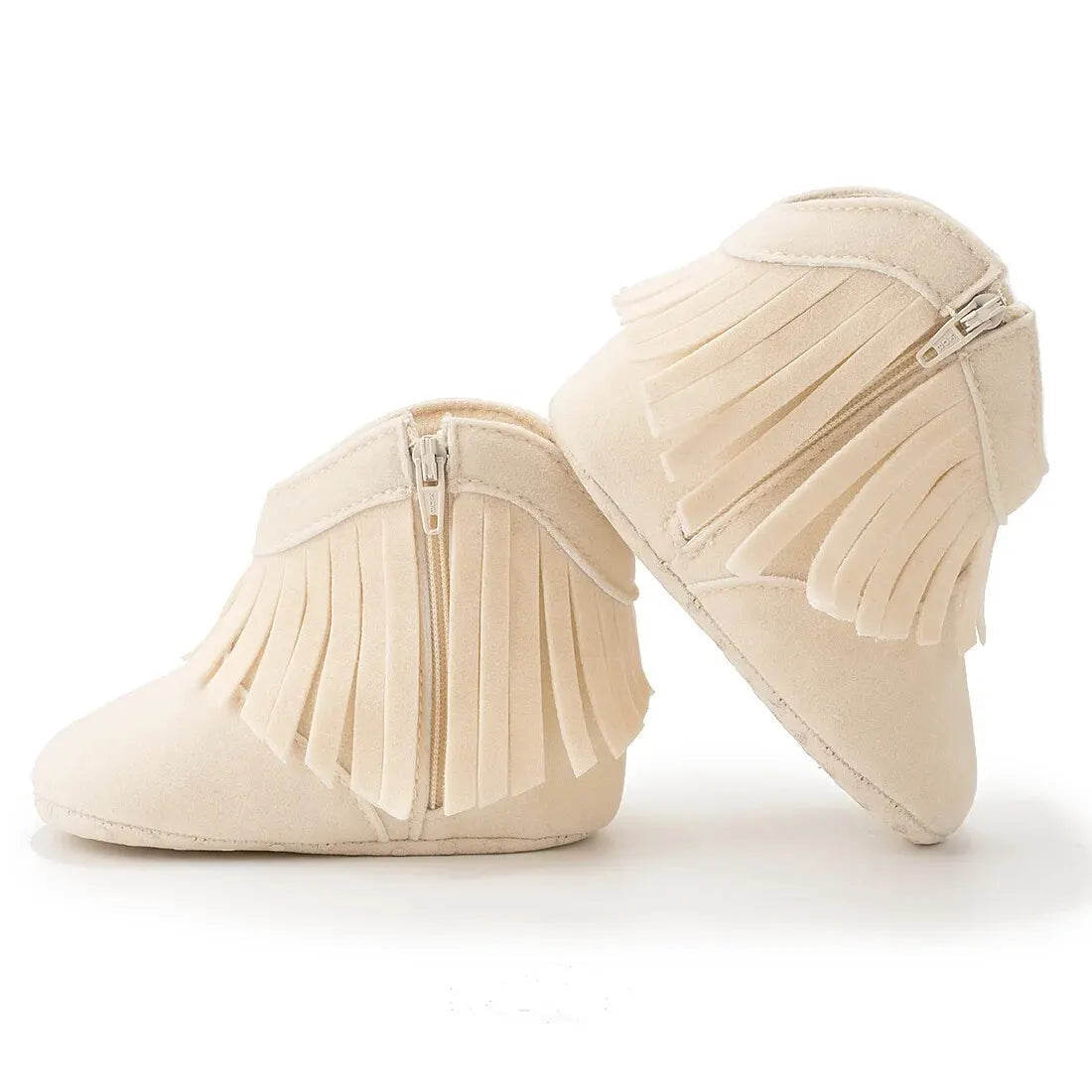 Side profile view of cream infant fringe suede booties with zipper closure on a white background.