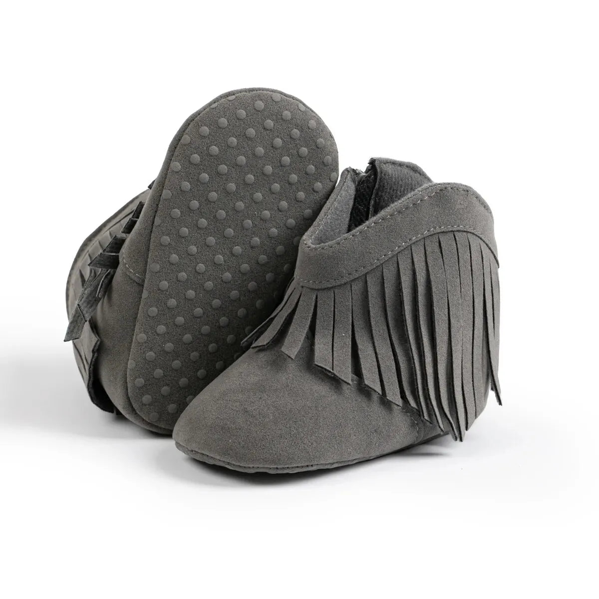 Gray baby western fringe moccasin booties showing the flexible soft sole and anti-slip dots on a white background.