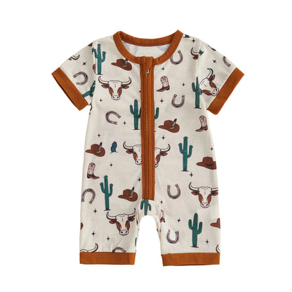 Front view of a cream-colored infant baby short sleeve zip-up romper featuring a western longhorn skull, cactus, and cowboy hat print with brown trim.