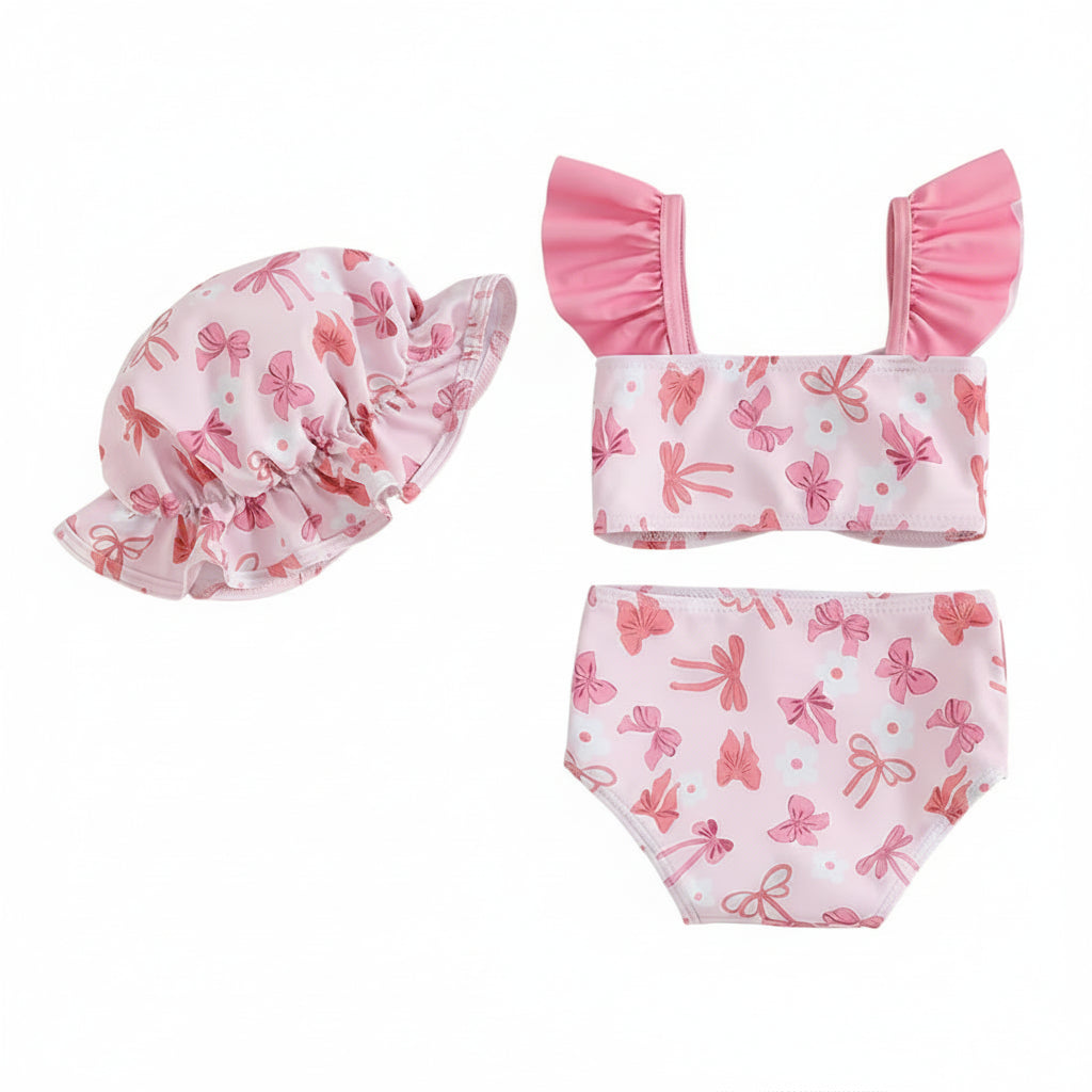 Back view of baby swimsuit set with pink bows on a white background