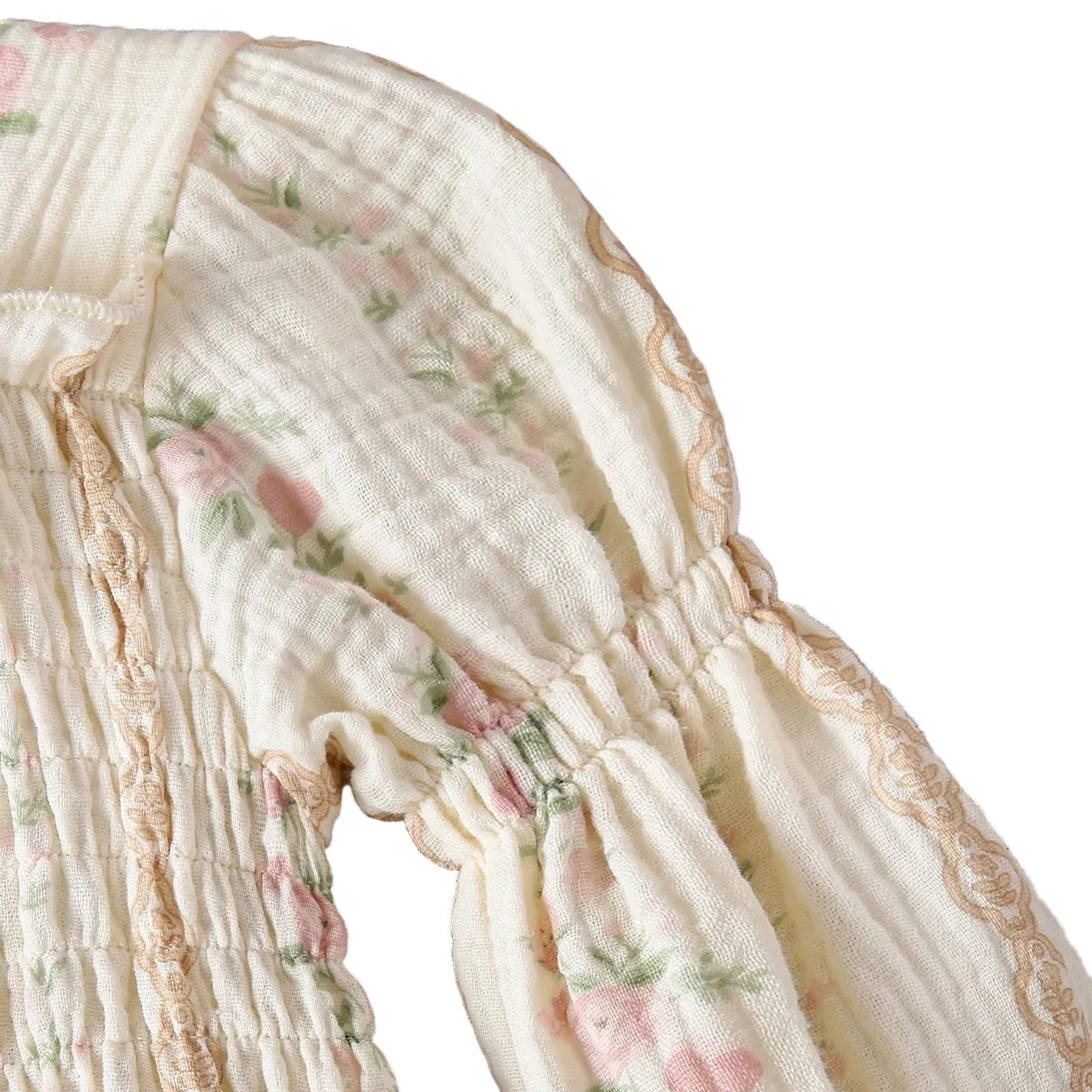 Close-up of the voluminous bishop sleeve and gathered shoulder detail featuring rustic lace trim on a cottagecore baby romper.