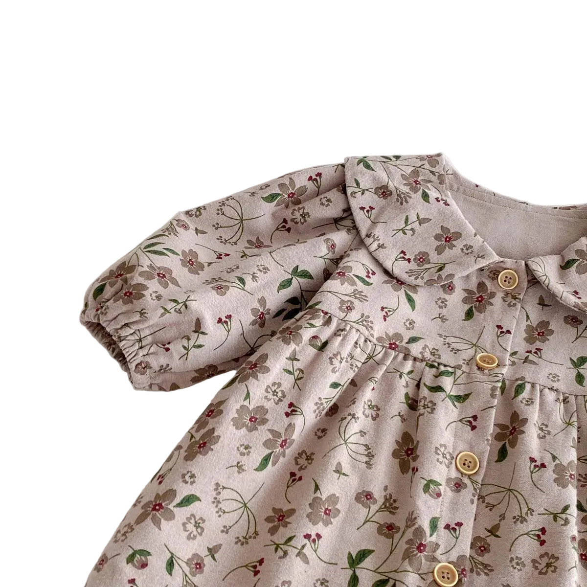 Close-up of the shoulder seam and balloon sleeve detailing on the Kidsely floral baby jumpsuit.