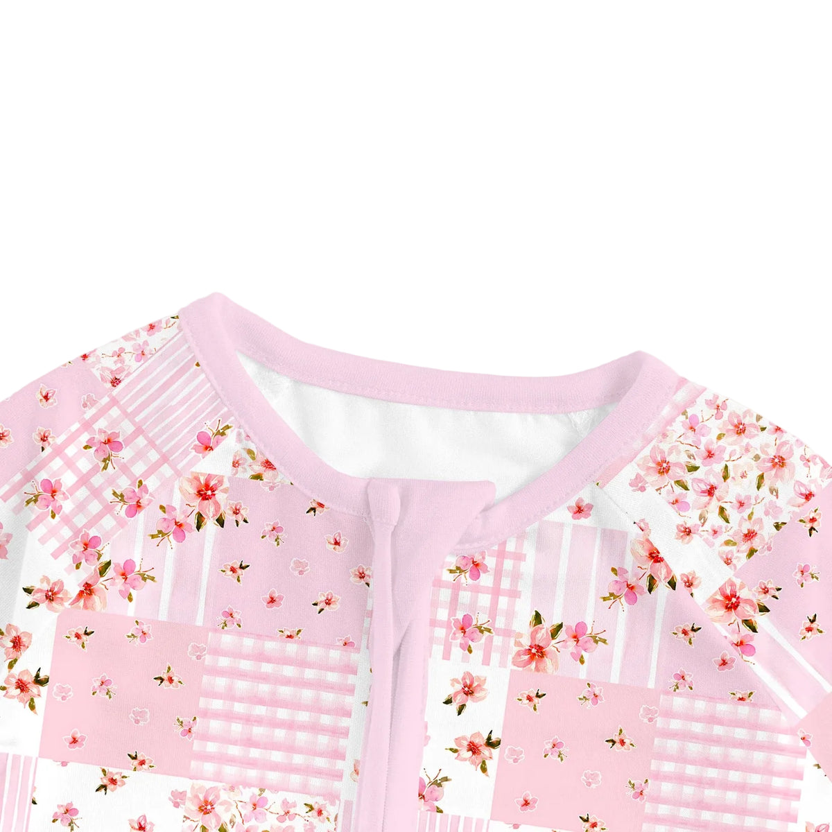 Close-up view of soft pink neckline trim and protective zipper guard on Kidsely floral quilt bamboo baby sleeper