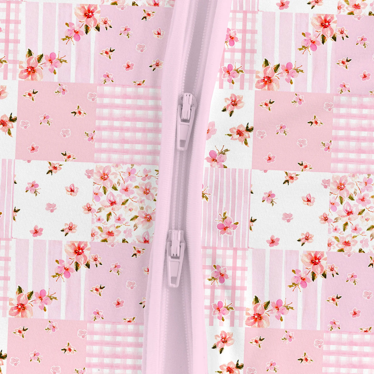Close-up detail of smooth 2-way dual zipper on Kidsely pink floral patchwork quilt bamboo viscose baby romper