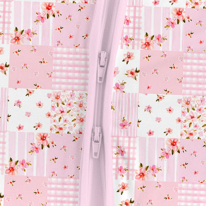 Close-up detail of smooth 2-way dual zipper on Kidsely pink floral patchwork quilt bamboo viscose baby romper