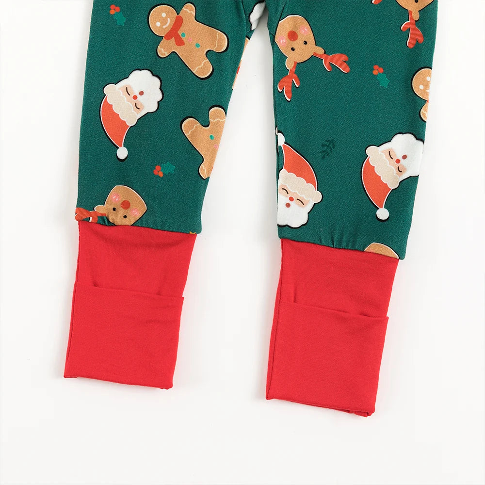 Close-up view of bright red fold-over convertible footie cuffs on Kidsely Santa and reindeer print bamboo sleeper