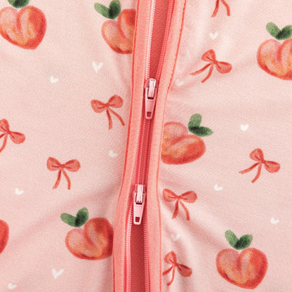 Close-up detail of smooth 2-way dual zipper on Kidsely sweet peach and bow print bamboo baby sleeper