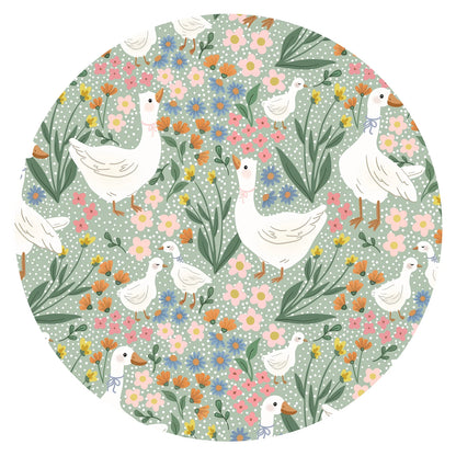 Close-up fabric detail of vintage cottagecore daisy goose garden floral print on sage green bamboo viscose
