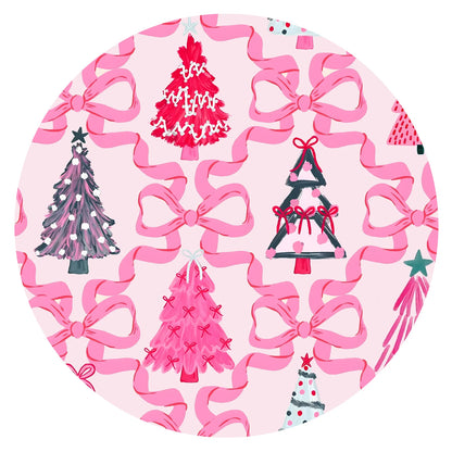 Close-up fabric detail of coquette holiday pink Christmas trees and ribbon bows print on soft bamboo viscose
