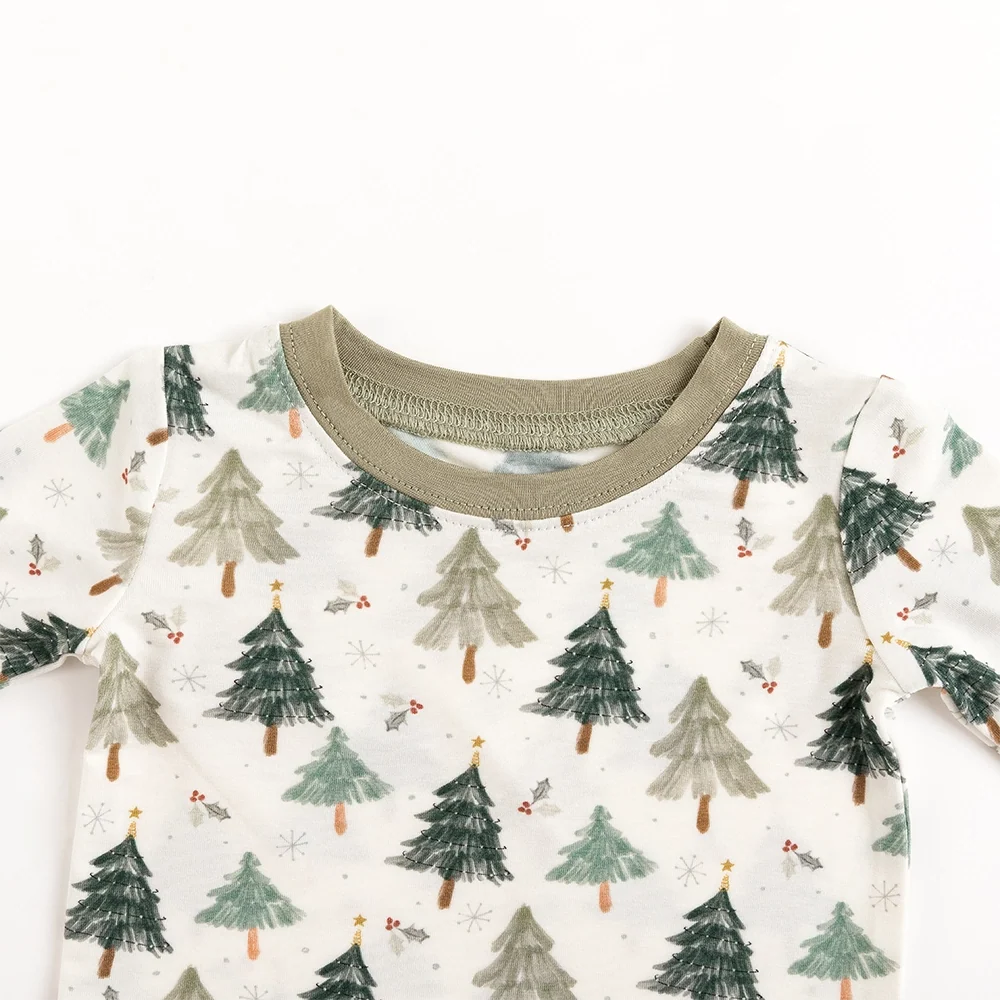 Close-up detail of sage green crewneck collar and tagless interior on Kidsely Evergreen Christmas Trees bamboo toddler pajama top