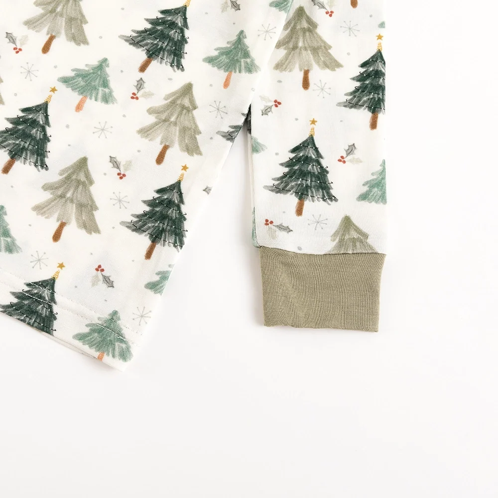 Close-up detail of sage green ribbed wrist cuffs on Kidsely Evergreen Christmas Trees print bamboo long sleeve toddler pajama top