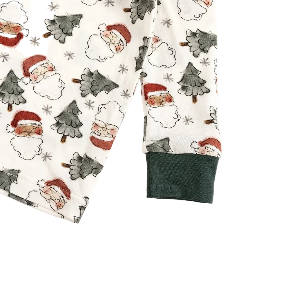 Close-up detail of forest green ribbed wrist cuffs on Kidsely Vintage Santa print bamboo long sleeve toddler pajama top