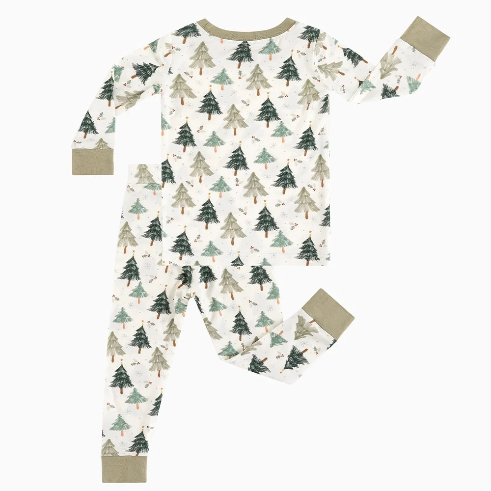 Flat lay view of Kidsely bamboo viscose toddler two-piece pajama set in Evergreen Christmas Trees print