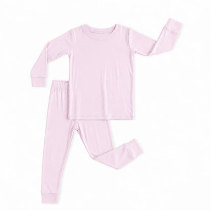 Kidsely soft bamboo viscose toddler two-piece pajama set in solid light pink featuring long sleeve crewneck top and matching pants