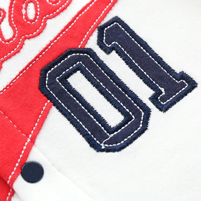Close up of the high-quality 01 embroidery and red pennant appliqué on the baby boy baseball outfit.