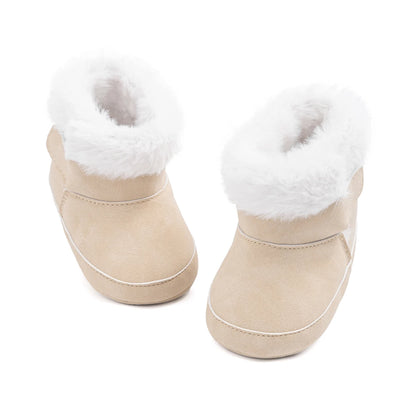 Top-down view of beige baby prewalker booties showing the soft sole shape and fuzzy interior.