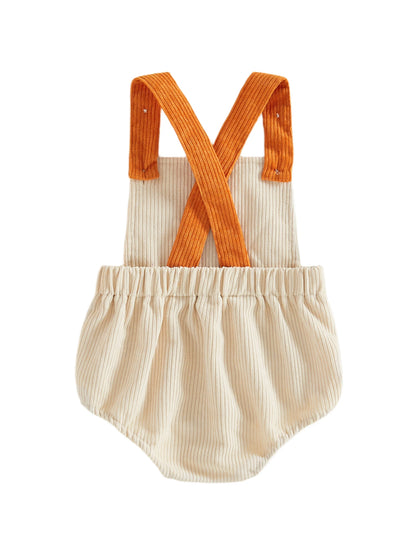 Back view of the beige baby corduroy bubble romper showing the criss-cross design of the orange shoulder straps.