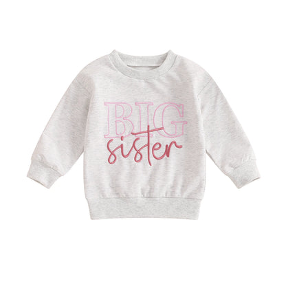 Light gray long-sleeve toddler girls sweatshirt featuring a pink Big Sister graphic on a white background.