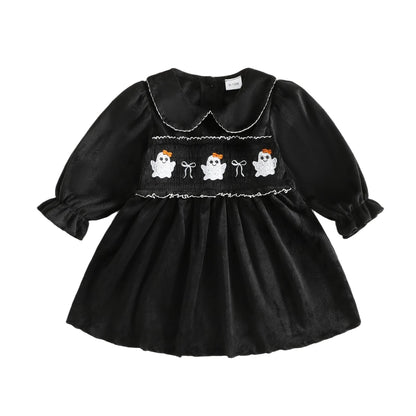 Black long sleeve baby and toddler girls Halloween dress featuring smocked ghost embroidery and a white-trimmed Peter Pan collar.