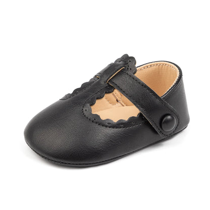 Single black PU leather infant T-strap Mary Jane shoe viewed from a slight front angle.