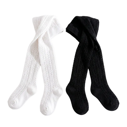 Flat lay of black and white chevron toddler tights.