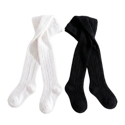 Flat lay of black and white chevron toddler tights.