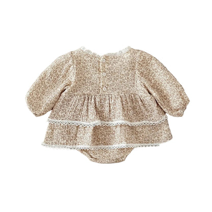 Back view of the baby girl's floral romper dress, displaying the convenient back button closures for easy dressing over the head.