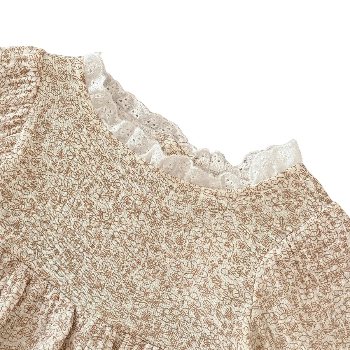  Close-up detail of the baby girl's boho floral romper neckline, showcasing the delicate white scalloped lace edge.