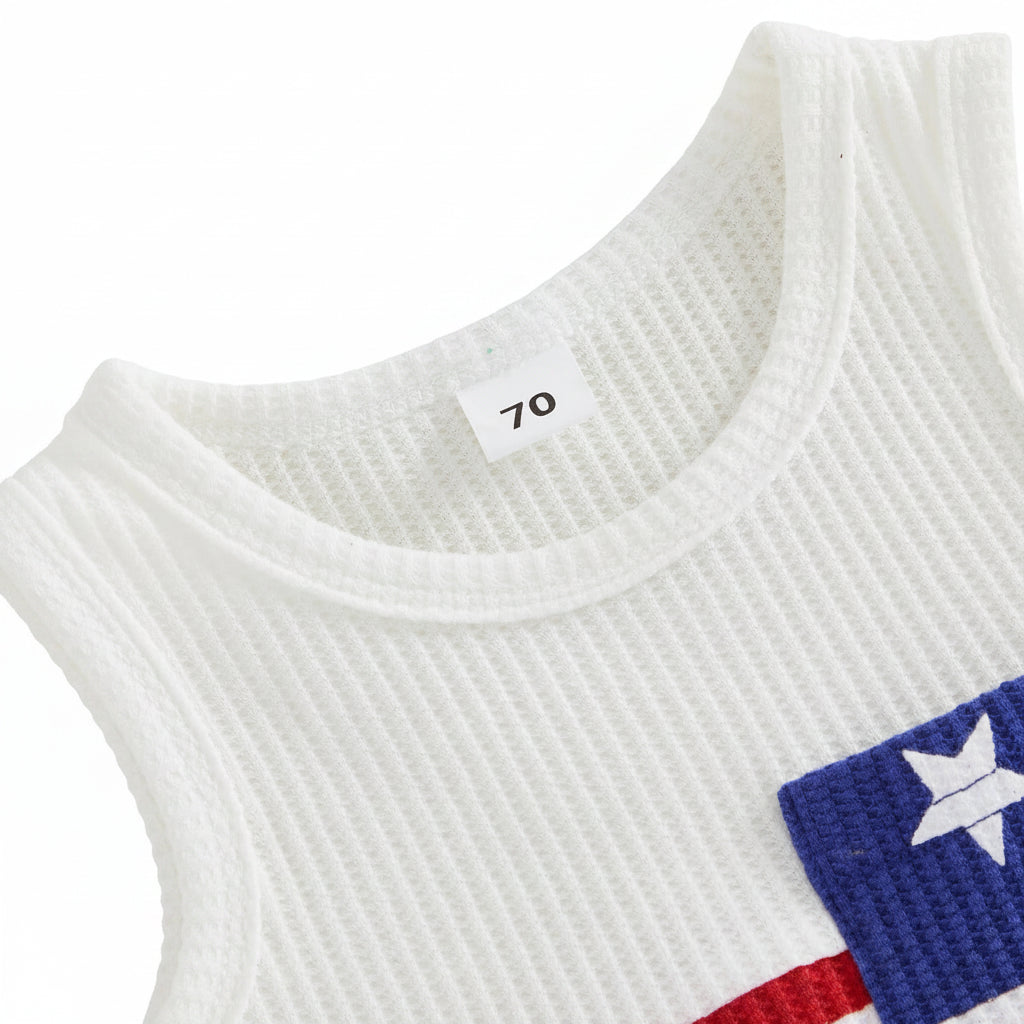Close-up of the ribbed crew neckline on the toddler boys white and red color-block tank top.