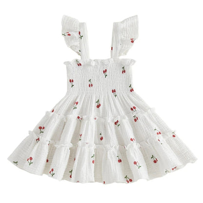 Kidsely Baby and Toddler Girl Smocked Cherry Summer Dress in Bright White featuring a square neck and cotton ruffled sleeves.