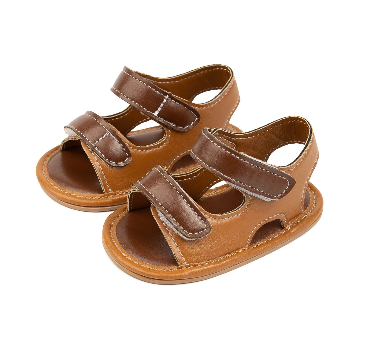 Brown vegan leather infant sandals with double velcro straps on a white background.