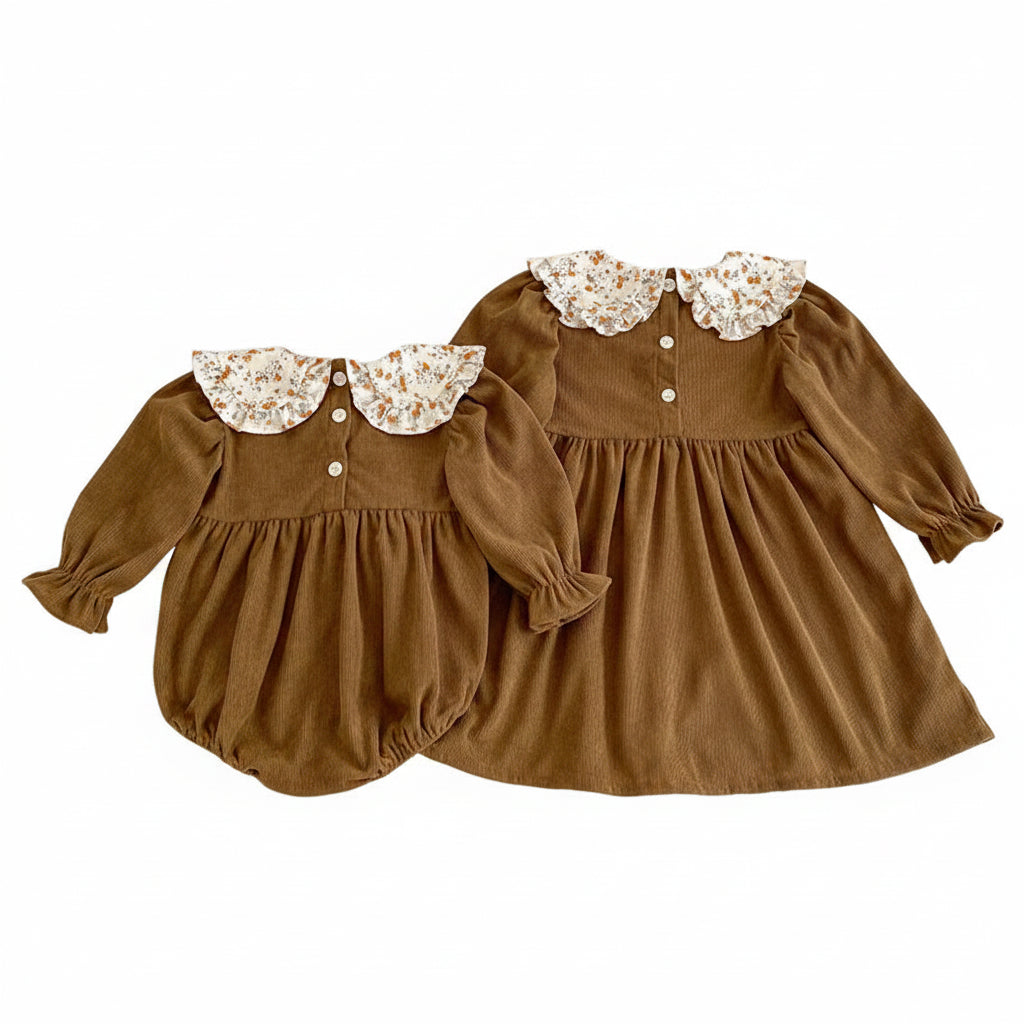 Back view of a matching brown corduroy baby romper and toddler dress set showing the back neck button closures on both garments.