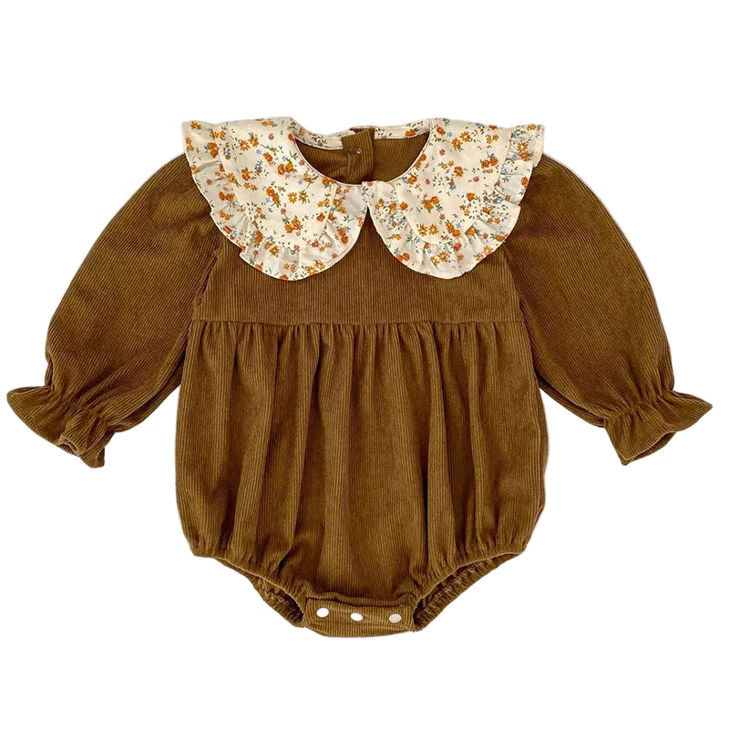 Front view of a warm brown ribbed corduroy baby girl long-sleeve romper featuring a ruffled floral Peter Pan collar.