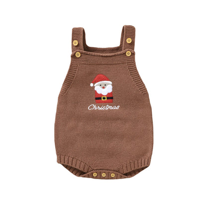 A flat product shot of a sleeveless brown knit baby romper featuring an embroidered Santa Claus face, the word "Christmas", and wooden buttons on the straps and bottom.