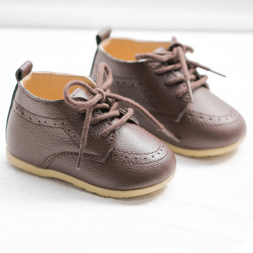 Side-by-side view of Kidsely brown textured faux leather toddler brogue oxfords with dark brown shoelaces.