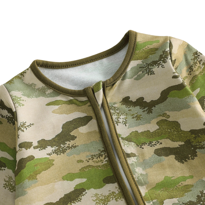 Close-up of the neckline on the camouflage baby romper showing the protective fabric zipper guard.