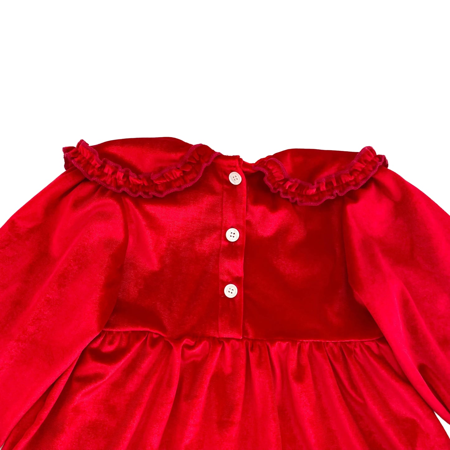 Close up of back button closures on cherry red velvet long sleeve holiday outfit