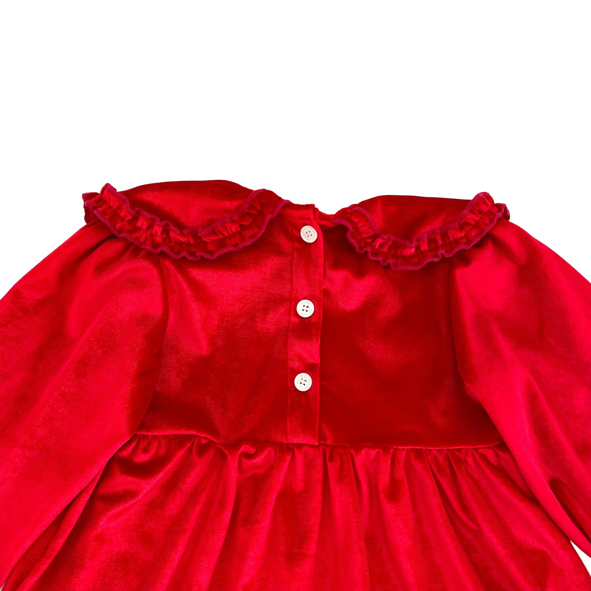 Close up of back button closures on cherry red velvet long sleeve holiday outfit