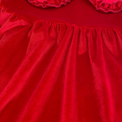 Detail of soft plush cherry red velvet fabric texture and gathered waist styling