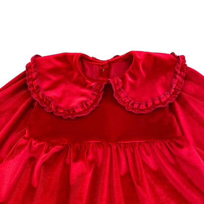 Close up detail of oversized ruffle Peter Pan collar on cherry red velvet holiday outfit