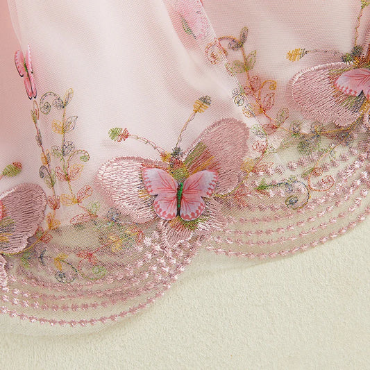 Embroidered fabric with pink butterflies and floral patterns on a light background